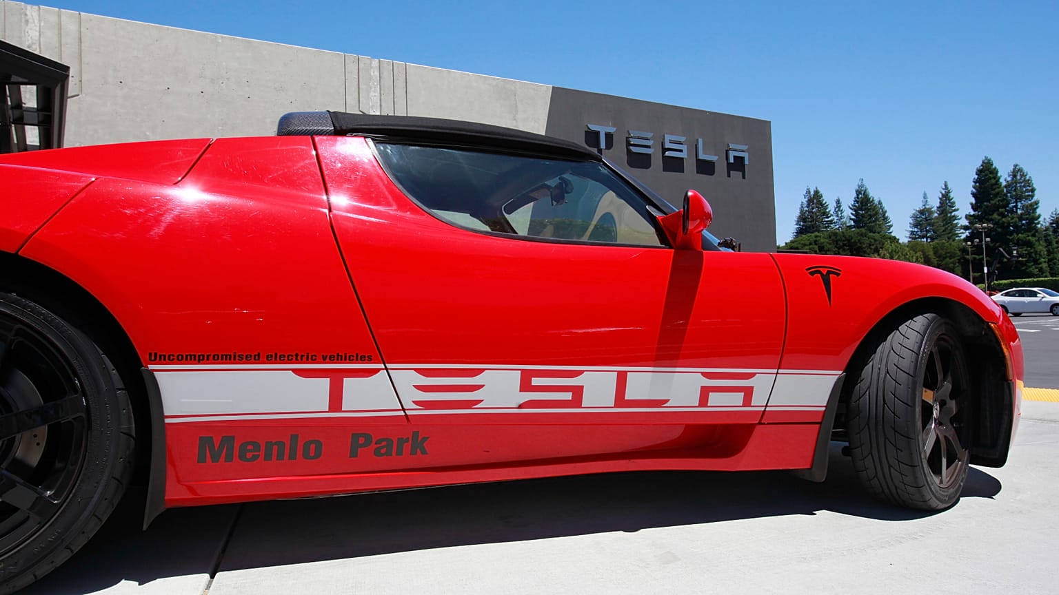 File photo - A Tesla electric sport car is on display outside the showroom in Menlo Park, Calif.