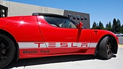 File photo - A Tesla electric sport car is on display outside the showroom in Menlo Park, Calif.