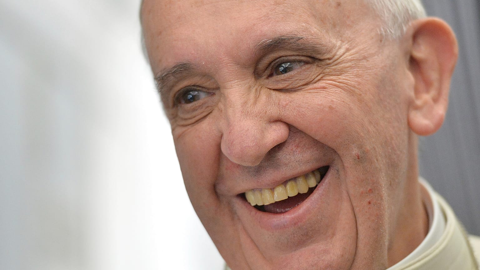 Pope Francis speaks to journalists during the papal flight direct to Rio de Janeiro, 22 July 2013