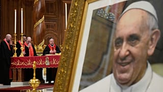 Priests pray during a requiem mass for the late Pope Francis at the St. George Cathedral in Beirut, 22 April, 2025