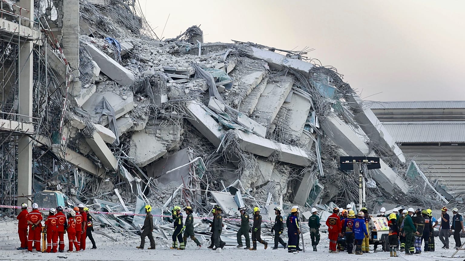 Rescuers work at the site a high-rise building under construction that collapsed after an earthquake in Bangkok, 28 March, 2025