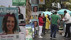People arrive at a polling place as early voting begins in Sydney, 22 April, 2025