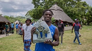 Wallace Mkanka holds his winning sculpture for an upcoming Oxford University exhibition on Cecil Rhodes’ legacy, at Chitungwiza Arts Centre near Harare, Zimbabwe.