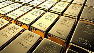 Filas de barras de ouro de 1 000 gramas cada