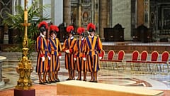 Vatican Swiss Guards wait in St. Peter's Basilica ahead of the arrival of the body of Pope Francis, who will lie in state for three days, at the Vatican, April 23, 2025. 