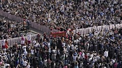 The body of Pope Francis is carried through St Peter's Square to St Peter's Basilica at the Vatican, 23 April, 2025
