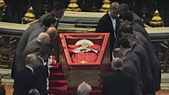 Pallbearers place the body of Pope Francis inside St Peter's Basilica at the Vatican, 23 April, 2025 