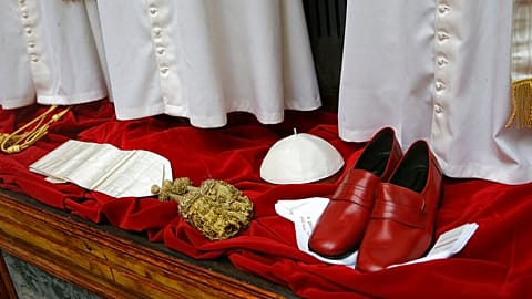 Papal robes on display in the window of the Gammarelli tailor's shop in Rome