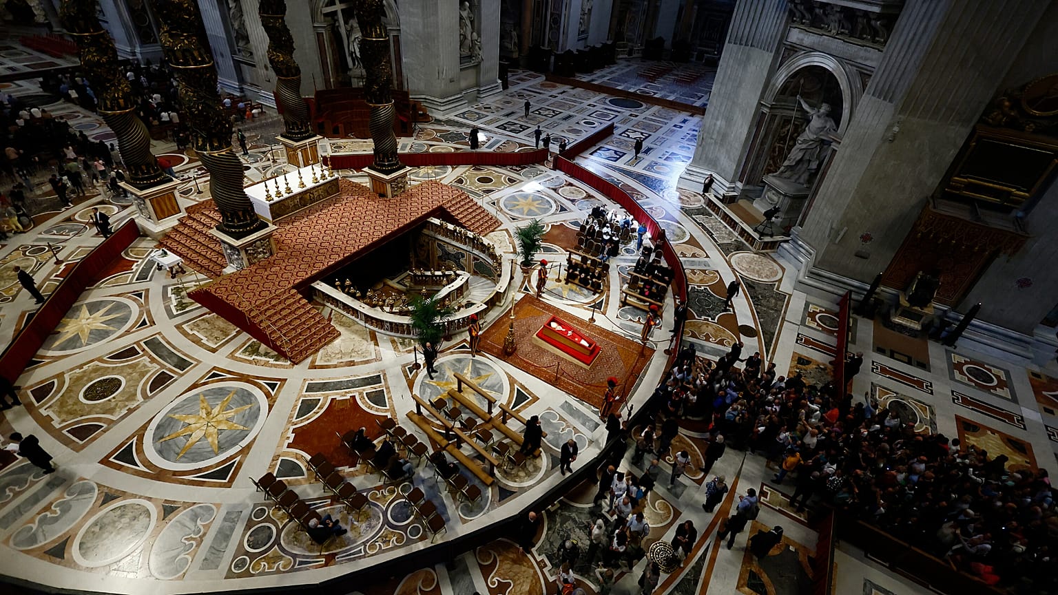 People queue to pay their respect to the late Pope Francis, who will lie in state at St. Peter's Basilica for three days, 23 April, 2025