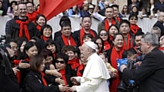 Pope Francis meets a group of faithful from China at the end of his weekly general audience in St. Peter's Square, at the Vatican, Wednesday, April 18, 2018. (AP Photo/Gregori