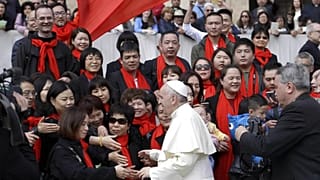 Pope Francis meets a group of faithful from China at the end of his weekly general audience in St. Peter's Square, at the Vatican, Wednesday, April 18, 2018. (AP Photo/Gregori
