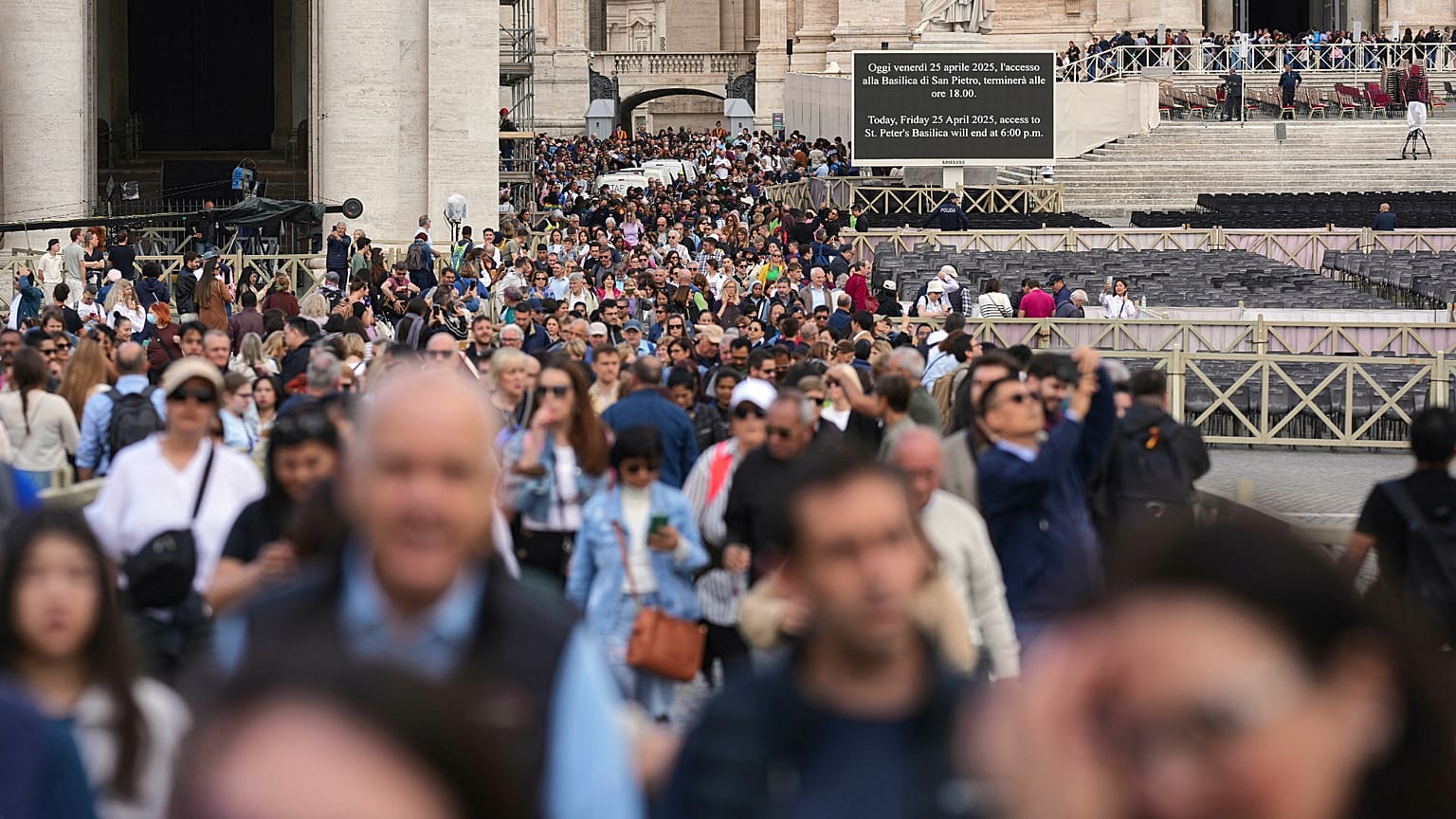 People wait in St. Peter's Square to pay their respects to the late Pope Francis, 25 April, 2025