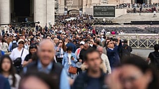 People wait in St. Peter's Square to pay their respects to the late Pope Francis, 25 April, 2025