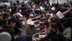 Palestinians line up for a meal in Rafah, 21 December, 2023