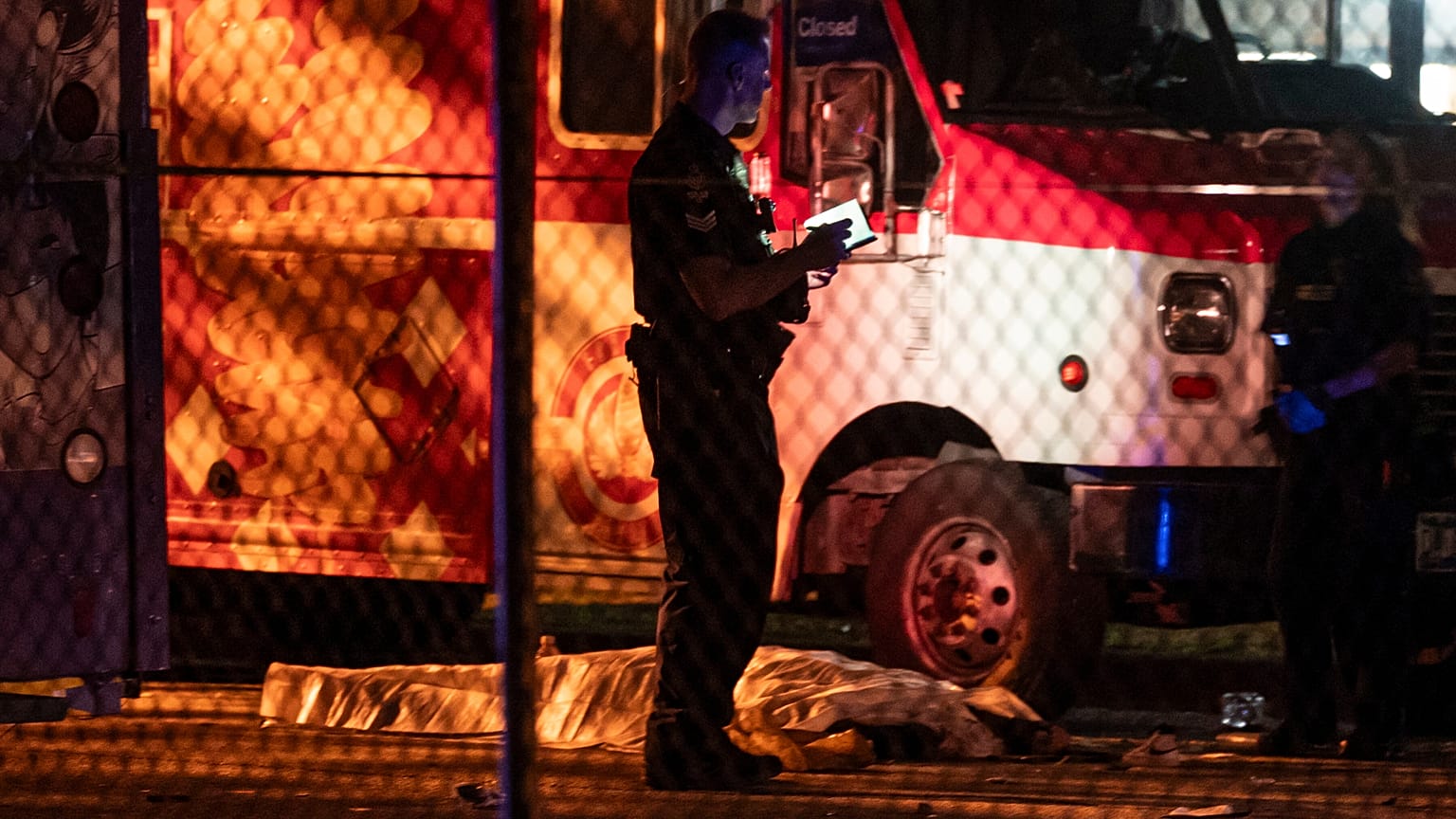 A victim lies near a food truck after a car drove into a crowd at the Lapu Lapu Festival in Vancouver on Saturday April 26, 2025.