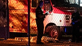 A victim lies near a food truck after a car drove into a crowd at the Lapu Lapu Festival in Vancouver on Saturday April 26, 2025.