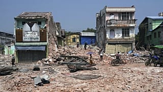 Volunteers help to clear a collapsed building one after the earthquake in Naypyidaw, 28 April, 2025