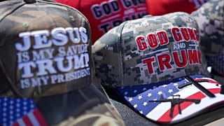 Hats reading, "God, Guns and Trump," and "Jesus is my savior, Trump is my president," are sold at a campaign rally for Donald Trump.
