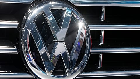 In this Sept. 22, 2015, file photo, the Volkswagen logo of a car is photographed during a car show in Frankfurt, Germany.