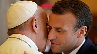 FILE: French President Emmanuel Macron goes to hug Pope Francis at the end of their private audience, at the Vatican, 26 June 2018