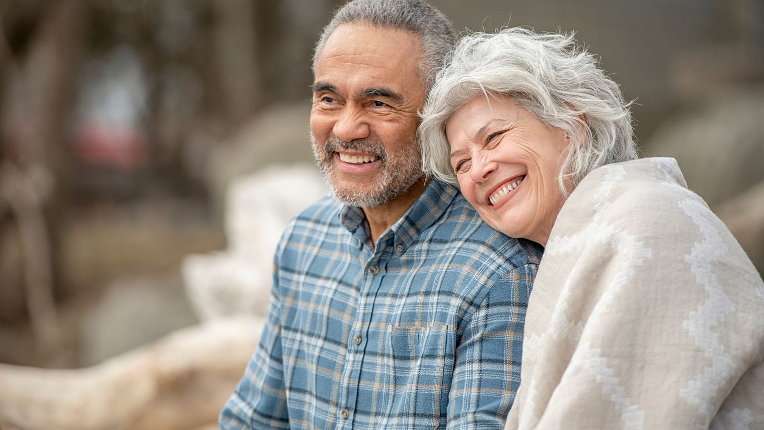 A senior couple sitting happily together. 