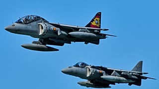 Two Spanish Navy's AV-8B Harrier II fighter jets fly as part of the NATO Dynamic Mariner/Flotex-25 naval exercise in Barbate, southern Spain, on March 28, 2025.