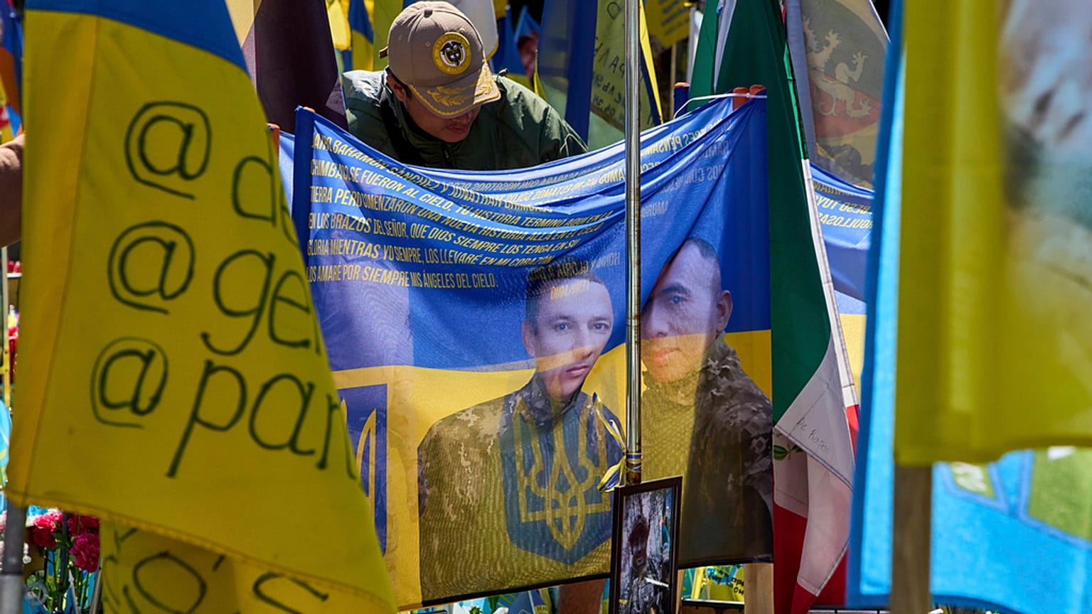 A Columbian volunteer of the Ukrainian army International Legion bows his head to commemorate his compatriots, who were killed on the battlefield in Ukraine.