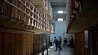 FILE: People tour the main cell house on Alcatraz Island in San Francisco, 15 March 2021