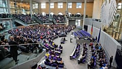 Lawmakers wait for the beginning of a session were Friedrich Merz is supposed to be elected new chancellor at the parliament Bundestag in Berlin, 6 May 2025
