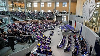 Lawmakers wait for the beginning of a session were Friedrich Merz is supposed to be elected new chancellor at the parliament Bundestag in Berlin, 6 May 2025