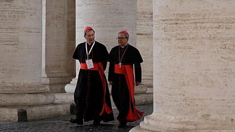 Two cardinals arrive at the New Hall of the Synod at the Vatican, 6 May, 2025