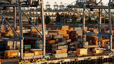  In this Wednesday, Jan. 14, 2015 file photo, shipping containers are stacked up waiting for truck transport at the Port of Los Angeles.