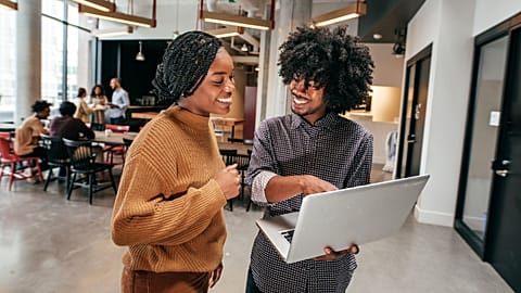 Two entrepreneurs working together in an office. 