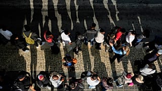 Passengers queue at Oriente transportation hub during a nationwide power outage in Lisbon, Monday, April 28, 2025.