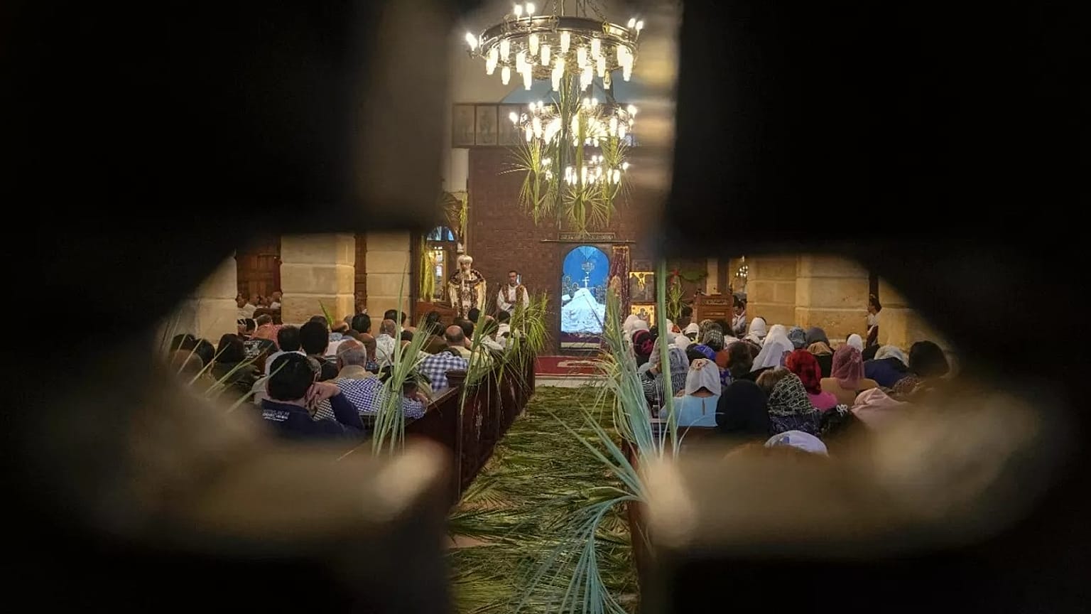 FILE: Bishop Daniel leads the Palm Sunday mass at the Church and Monastery of the Virgin Mary, in Cairo, 9 April 2023