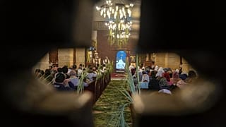 FILE: Bishop Daniel leads the Palm Sunday mass at the Church and Monastery of the Virgin Mary, in Cairo, 9 April 2023