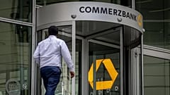 A man walks towards the entrance of the headquarters of the Commerzbank in Frankfurt, Germany, Tuesday, Sept. 24, 2024.
