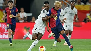 Barcelona's Lamine Yamal, right, fights for the ball with Real Madrid's Vinicius Junior during the Spanish Copa del Rey final, April 2025.