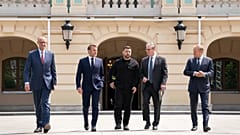 Four European leaders and Ukrainian President Volodymyr Zelenskyy walk at the Presidential Palace in Kyiv, 10 May 2025