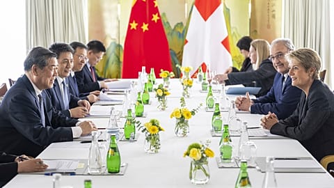 Chinese Vice Premier He Lifeng, left, Swiss Economy Minister Federal Councillor Guy Parmelin, center, Switzerland's President Karin Keller-Sutter, right, Geneva, 10.05.2025