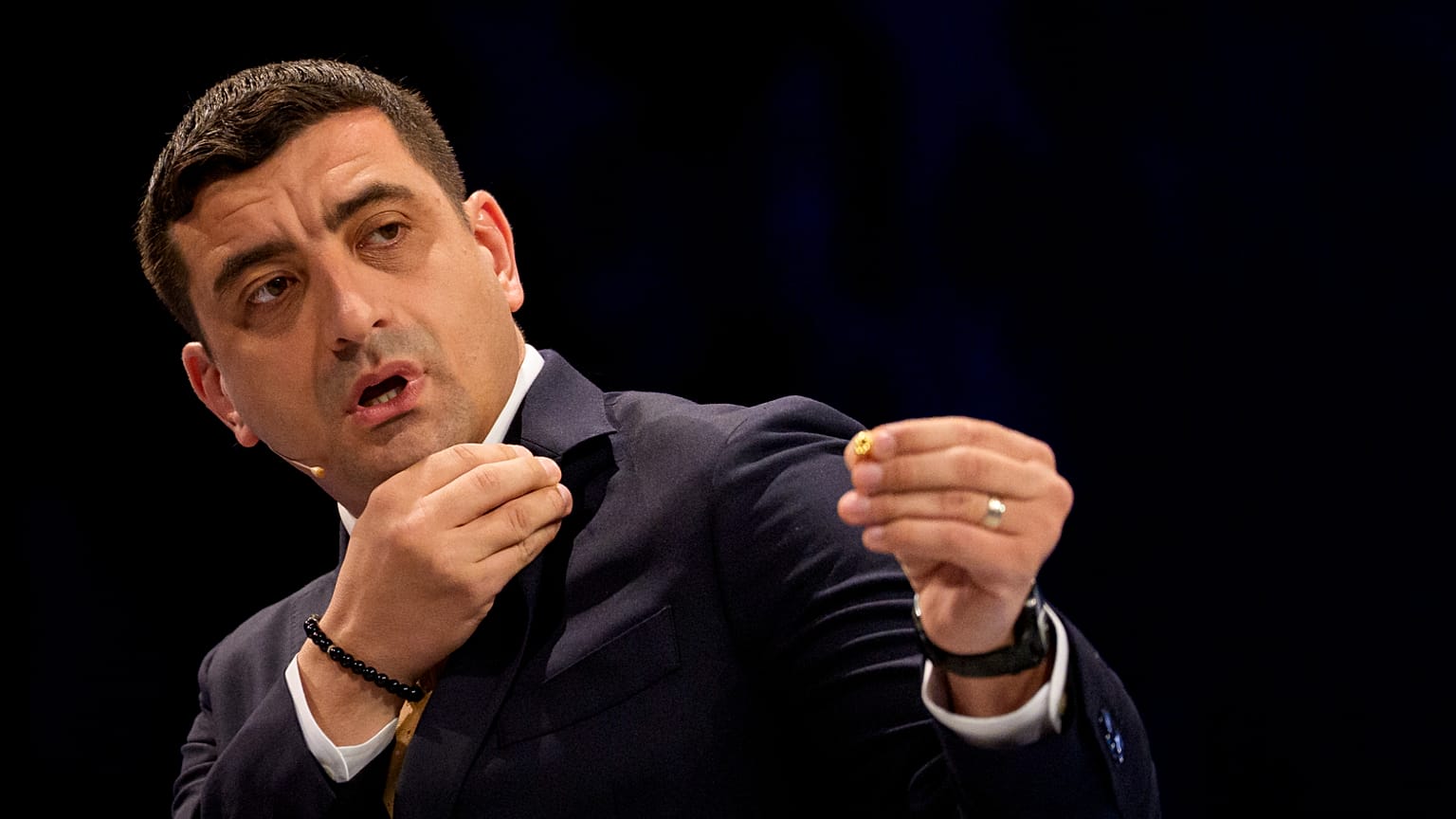 Presidential candidate George Simion gestures during Euronews Romania's live electoral debate with Nicusor Dan ahead of the election runoff in Bucharest, 8 May 2025