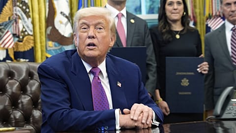 President Donald Trump speaks with reporters as he signs executive orders in the Oval Office at the White House. 9 May, 2025, in Washington.