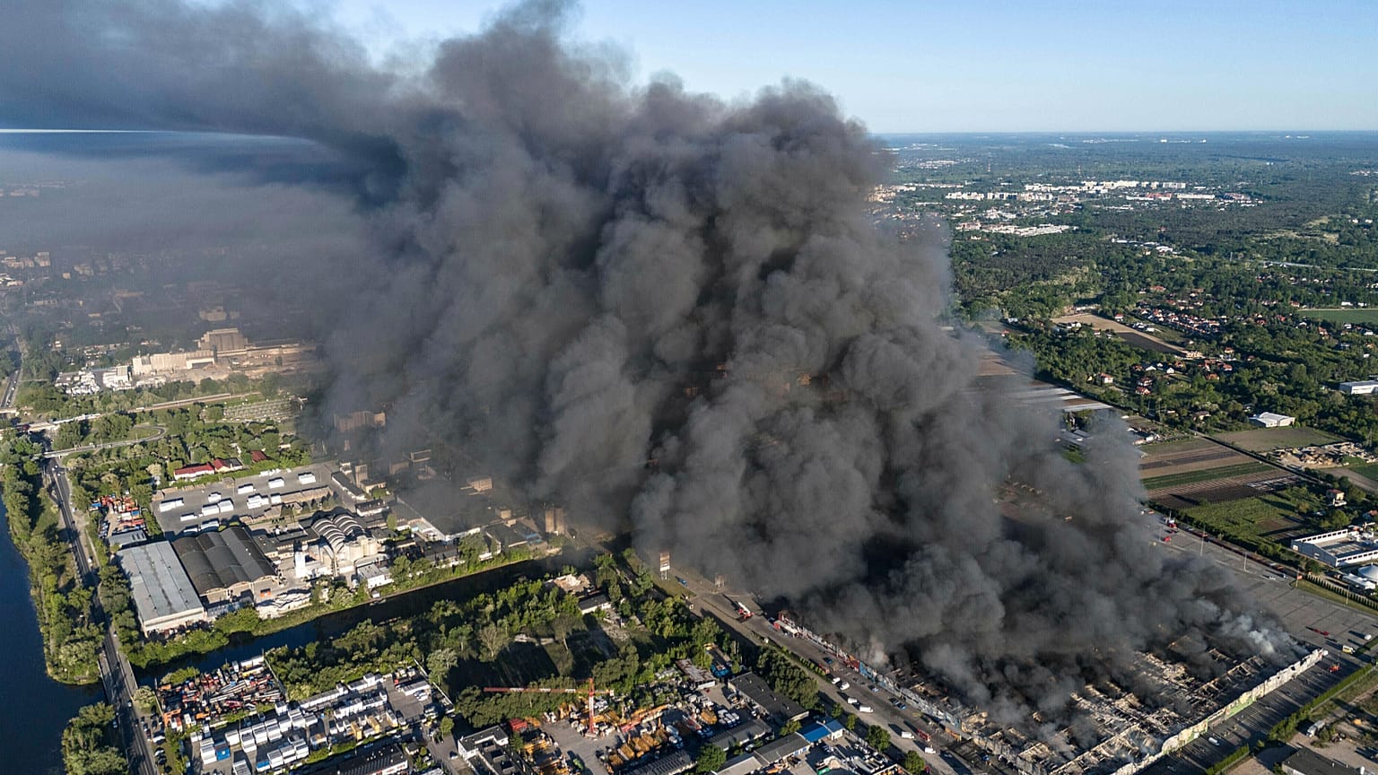 A fire burns from a vast shopping complex in Warsaw, 12 May, 2024