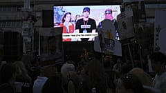 People gather in Tel Aviv to watch a live broadcast of Israeli-American soldier Edan Alexander being released by Hamas, 12 May, 2025