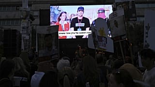 People gather in Tel Aviv to watch a live broadcast of Israeli-American soldier Edan Alexander being released by Hamas, 12 May, 2025