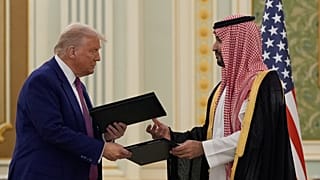 President Donald Trump and Saudi Crown Prince Mohammed bin Salman exchange documents during a signing ceremony in Riyadh, 13 May, 2025