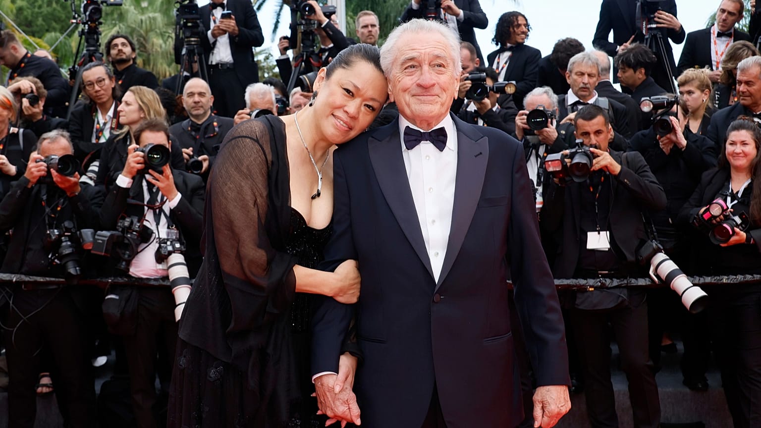 Robert De Niro and Tiffany Chen pose for photographers during the opening ceremony red carpet of the 78th international film festival, Cannes, France, Tuesday, May 13, 2025