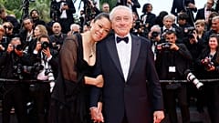 Robert De Niro and Tiffany Chen pose for photographers during the opening ceremony red carpet of the 78th international film festival, Cannes, France, Tuesday, May 13, 2025