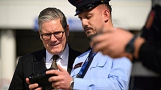 Britain's Prime Minister Keir Starmer speaks with a drone operator at the ferry port in Tirana, Albania, 15 May 2025.
