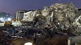 FILE: Rescuers search for victims at the site of a high-rise building under construction that collapsed after a strong earthquake in Bangkok, 29 March 2025